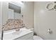 Bathroom with modern vanity, decorative mirror, and unique hexagon tile accent wall at 2010 Quaker Lndg # 102, Raleigh, NC 27603