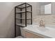 Updated bathroom with neutral color palette has new marble shelving and modern faucet at 2010 Quaker Lndg # 102, Raleigh, NC 27603