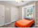 Bedroom boasts wood floor, built in shelves and a window that brings in ample natural light at 2010 Quaker Lndg # 102, Raleigh, NC 27603