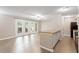 Bright living room features hardwood floors, lots of natural light, and breakfast bar to kitchen at 2010 Quaker Lndg # 102, Raleigh, NC 27603