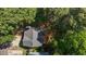 Aerial view displays the property's layout, surrounding greenery, and classic roof design at 203 Kronos Lane, Cary, NC 27513