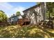 The home's backyard showcases a wooden deck, complemented by the fenced yard at 203 Kronos Lane, Cary, NC 27513