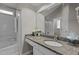 Bathroom featuring granite countertop, tile floor, and shower at 203 Kronos Lane, Cary, NC 27513