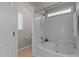 Bathtub with shower and white tile at 203 Kronos Lane, Cary, NC 27513