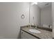Bathroom featuring granite countertop and updated fixtures at 203 Kronos Lane, Cary, NC 27513