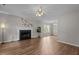 Spacious living room with fireplace, ceiling fan, and wood floors at 203 Kronos Lane, Cary, NC 27513