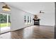 Spacious living room with fireplace and sliding glass doors to the patio at 206 Wynngate Dr, Cameron, NC 28326