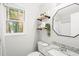 Charming bathroom featuring granite countertops, modern sink and fixtures, and decorative shelves at 21 Cedar Hill Dr, Durham, NC 27713
