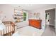 Bright Bedroom with a changing table, wooden crib, and bookshelf filled with books, creating a cozy atmosphere at 21 Cedar Hill Dr, Durham, NC 27713