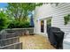 Wooden deck with outdoor seating, an umbrella, and a grill, perfect for relaxing or entertaining outdoors at 21 Cedar Hill Dr, Durham, NC 27713