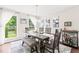 Cozy dining room featuring a large window, table with seating for six and modern decor at 21 Cedar Hill Dr, Durham, NC 27713