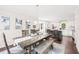 Open dining room with a view into a modern kitchen and ample seating at 21 Cedar Hill Dr, Durham, NC 27713