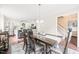 Open dining room with a view into a modern kitchen and stairway at 21 Cedar Hill Dr, Durham, NC 27713