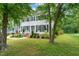 Charming two-story home with white siding, black shutters, brick foundation and inviting front yard at 21 Cedar Hill Dr, Durham, NC 27713