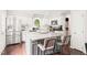 Modern kitchen featuring granite countertops, stainless steel appliances, and barstool seating at 21 Cedar Hill Dr, Durham, NC 27713