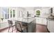 Beautiful kitchen with white cabinets, granite countertops, stainless steel appliances and large island at 21 Cedar Hill Dr, Durham, NC 27713