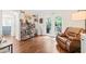 Cozy living room with a leather chair and access to the outdoor patio at 21 Cedar Hill Dr, Durham, NC 27713