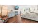 Bright living room with fireplace, hardwood floors, large windows and comfortable seating at 21 Cedar Hill Dr, Durham, NC 27713
