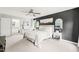 Spacious main bedroom featuring a ceiling fan, large windows, and modern decor at 21 Cedar Hill Dr, Durham, NC 27713