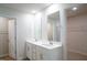 Bright bathroom featuring double sink vanity, large mirrors, and walk-in closet at 2106 Cherry Creek Road Rd, Haw River, NC 27258