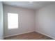Bright bedroom featuring light wood floors, a window, and neutral wall paint at 2106 Cherry Creek Road Rd, Haw River, NC 27258