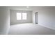 Neutral bedroom with carpet, windows, and attached bathroom at 2106 Cherry Creek Road Rd, Haw River, NC 27258