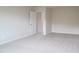 Bedroom with neutral carpeting and paint and a walk-in closet at 2106 Cherry Creek Road Rd, Haw River, NC 27258