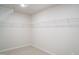 Walk-in closet with white wire shelving and neutral carpeting at 2106 Cherry Creek Road Rd, Haw River, NC 27258
