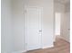 Bright hallway featuring light wood floors and white trim leading to other rooms at 2106 Cherry Creek Road Rd, Haw River, NC 27258