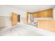 Spacious basement area featuring wood paneling, a bar, and carpet flooring, ready to be remodeled at 211 Cool Spring Rd, Durham, NC 27713