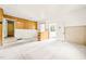 Bright basement area featuring wood paneling, a bar, and carpet flooring, ready for personalization at 211 Cool Spring Rd, Durham, NC 27713
