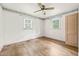 A bedroom offers hardwood floors, natural light, and a ceiling fan at 211 Cool Spring Rd, Durham, NC 27713