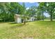 A quaint house surrounded by green trees in a spacious yard at 211 Cool Spring Rd, Durham, NC 27713