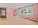 Living room with wood floors and a large bay window offering natural light and views of the outdoors at 211 Cool Spring Rd, Durham, NC 27713