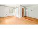 Empty living room with wood floors, vintage wallpaper, and a sliding barn door, ready for customization at 211 Cool Spring Rd, Durham, NC 27713