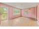 A spacious living room offers natural light with large windows and hardwood floors at 211 Cool Spring Rd, Durham, NC 27713