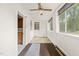 A sun room with a ceiling fan and a window, offering natural light at 211 Cool Spring Rd, Durham, NC 27713