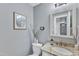 Updated bathroom with granite vanity top, decorative eucalyptus branches and framed wall art at 2125 Oakcrest Ct, Raleigh, NC 27612