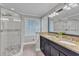 Bathroom featuring a double sink and glass shower at 2125 Oakcrest Ct, Raleigh, NC 27612