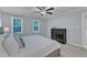 Bedroom featuring carpet, ceiling fan, light blue wall color, and windows at 2125 Oakcrest Ct, Raleigh, NC 27612