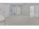 Light and airy bedroom with neutral walls and carpet featuring dual closets and a vaulted ceiling at 2125 Oakcrest Ct, Raleigh, NC 27612