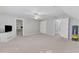 Large bonus room featuring multiple doorways, neutral carpet and access to storage at 2125 Oakcrest Ct, Raleigh, NC 27612