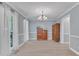 Formal dining room featuring neutral paint, natural light, and light wood floors at 2125 Oakcrest Ct, Raleigh, NC 27612
