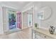 Bright foyer with light wood floors, neutral paint, and an open doorway at 2125 Oakcrest Ct, Raleigh, NC 27612