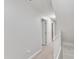 Upstairs hallway with neutral walls and carpet at 2125 Oakcrest Ct, Raleigh, NC 27612