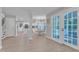 Spacious kitchen has stainless appliances, and white cabinets with view to dining room at 2125 Oakcrest Ct, Raleigh, NC 27612
