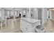 Kitchen with stainless steel appliances, granite countertops, white cabinetry, and an island at 2125 Oakcrest Ct, Raleigh, NC 27612