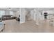 Open-concept living room with hardwood floors, neutral paint, and an open staircase to the second floor at 2125 Oakcrest Ct, Raleigh, NC 27612