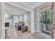 Open living room with a fireplace, neutral paint, and a view to the front door at 2125 Oakcrest Ct, Raleigh, NC 27612