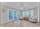 Bright sunroom with French doors, transom windows and cozy seating at 2125 Oakcrest Ct, Raleigh, NC 27612